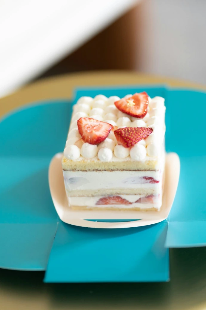 a piece of cake sitting on top of a blue plate
